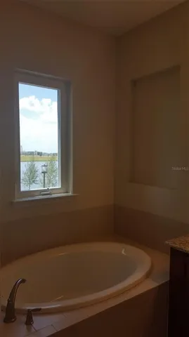 a view of a bathtub in a bathroom