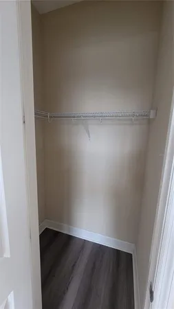 an empty room with wooden floor