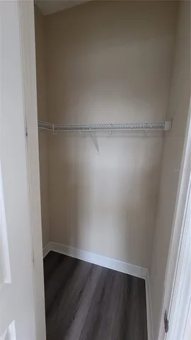 an empty room with wooden floor