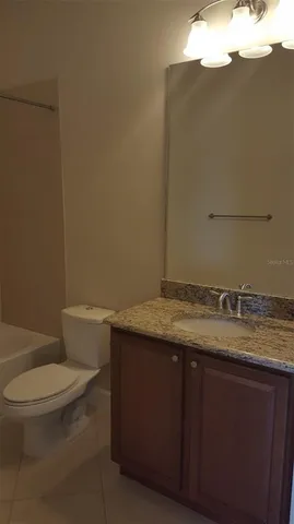 a bathroom with a shower and a toilet