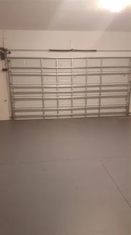 a view of a lake in middle of a yard