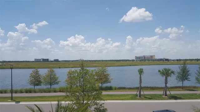 a view of a lake with a yard