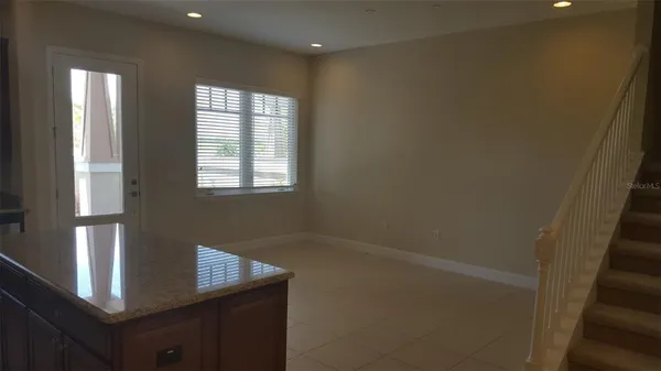 a view of an empty room with windows