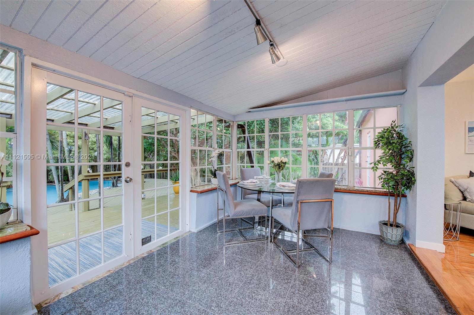 331 Southwest 19th Road Miami, FL 33129 - Photo 11 of 22 a work room with furniture and large windows