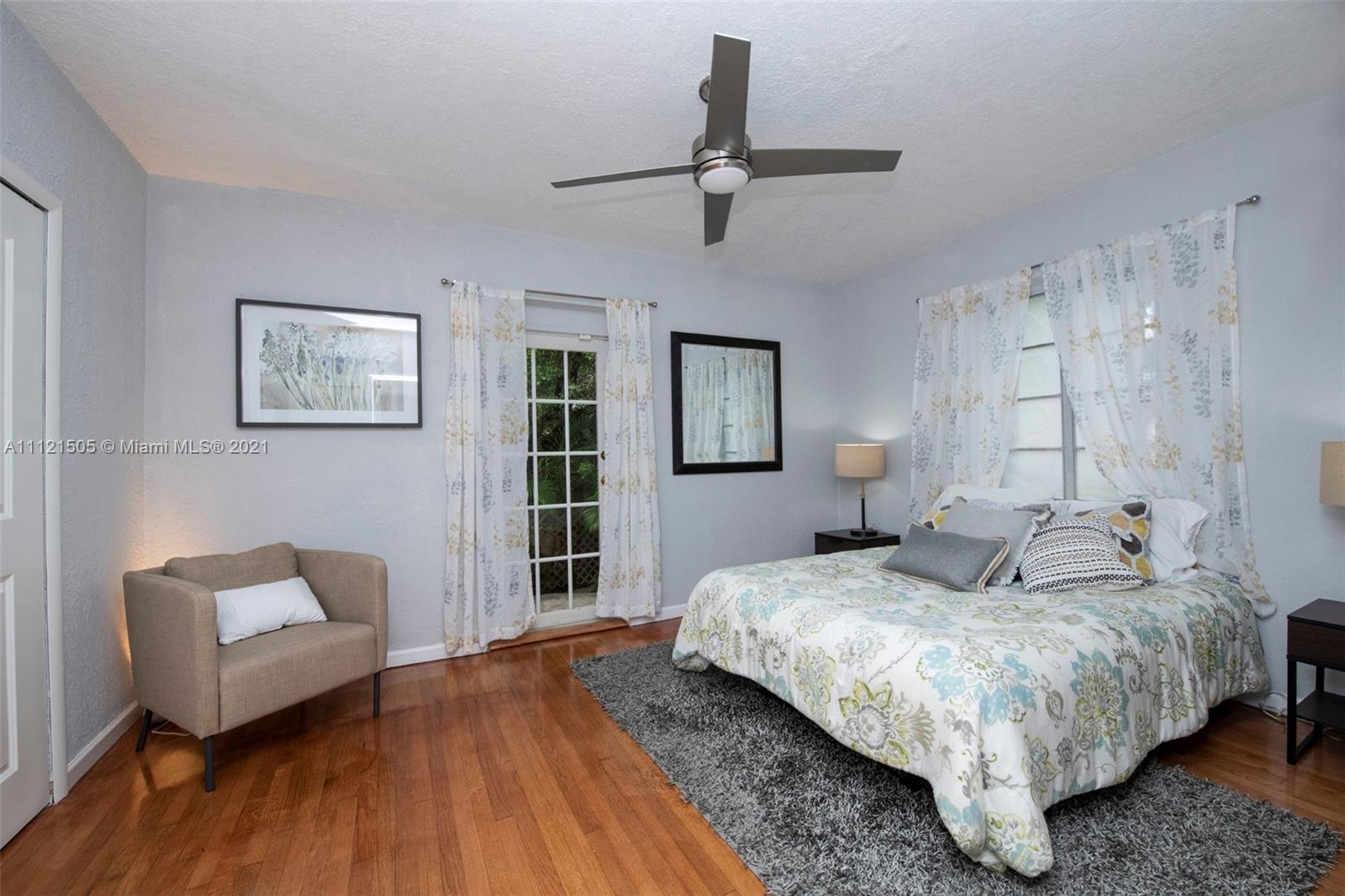 331 Southwest 19th Road Miami, FL 33129 - Photo 12 of 22 a bedroom with a bed and a couch