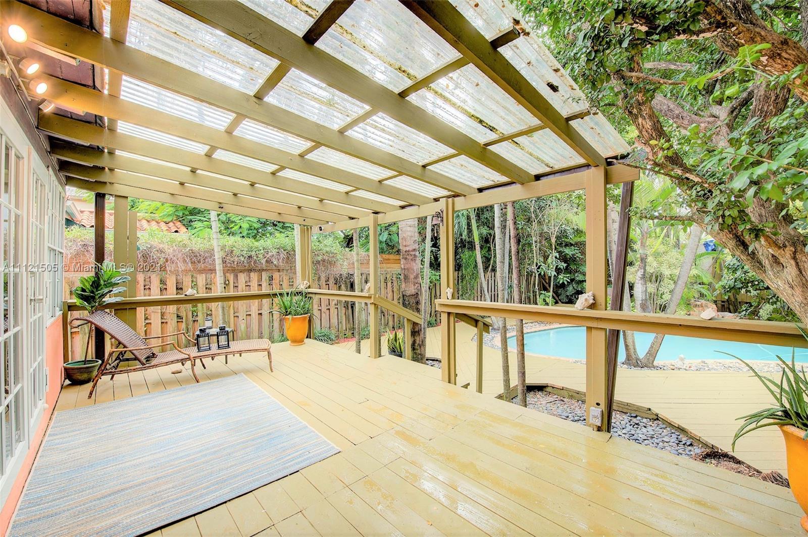 331 Southwest 19th Road Miami, FL 33129 - Photo 19 of 22 a view of a swimming pool with a patio