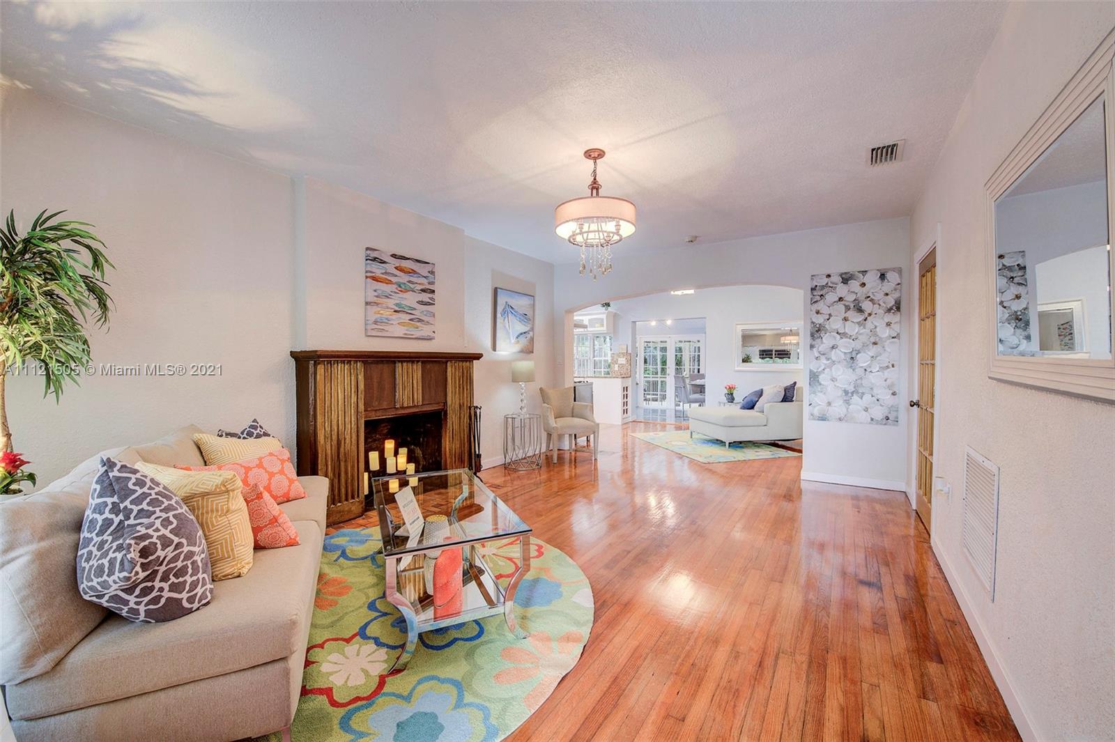 331 Southwest 19th Road Miami, FL 33129 - Photo 5 of 22 a living room with furniture and a fireplace