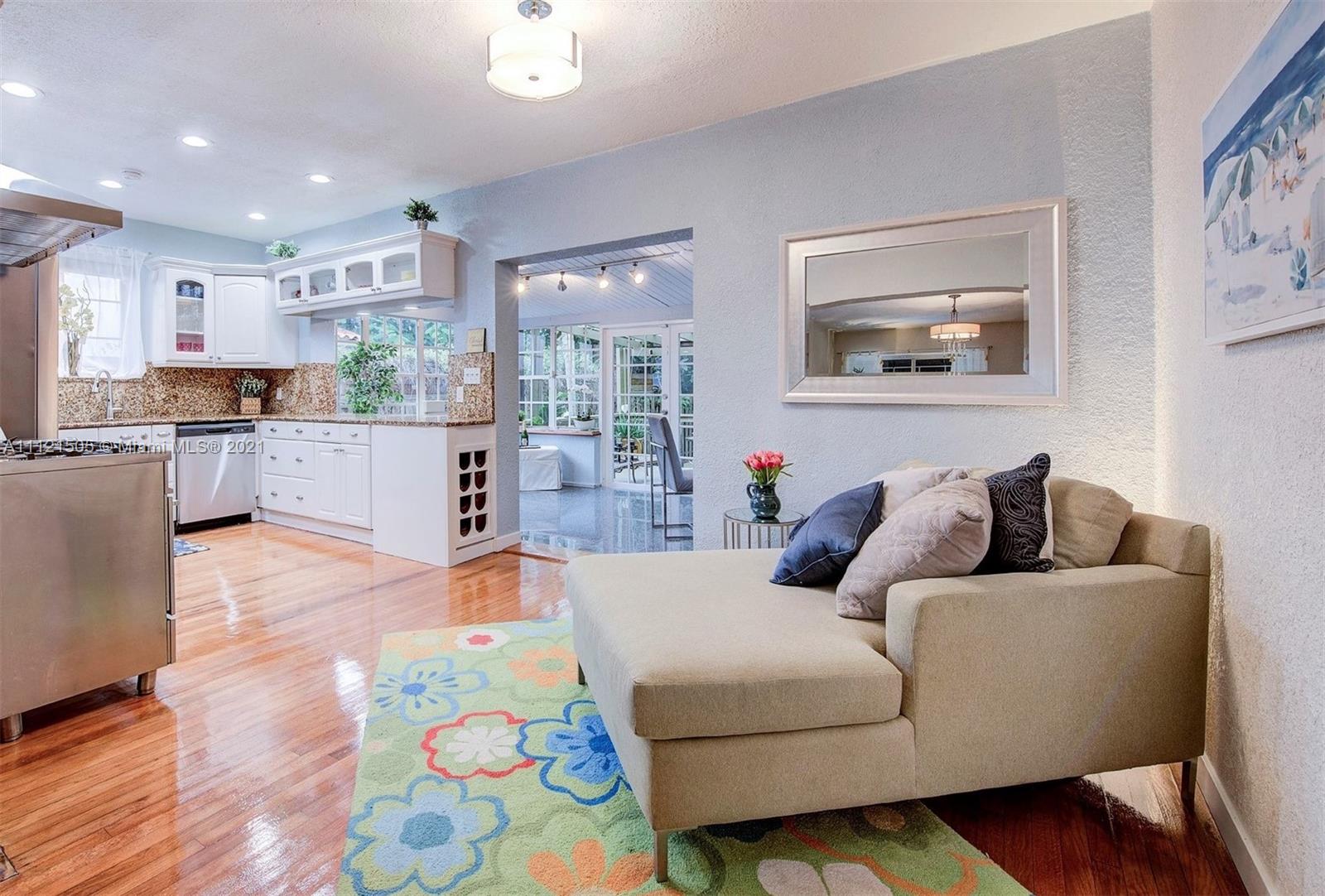331 Southwest 19th Road Miami, FL 33129 - Photo 7 of 22 a living room with furniture and painting on the wall next to a window