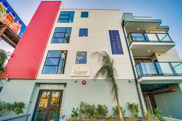 a front view of a multi story residential apartment building