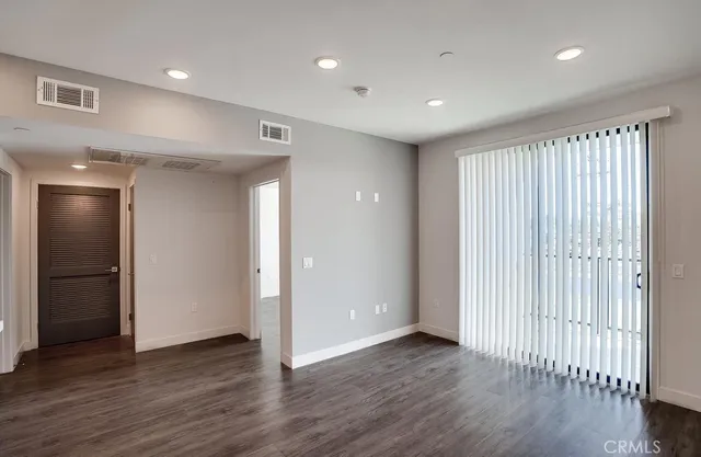 a view of a livingroom with wooden floor