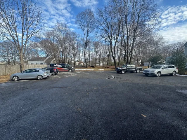 a view of street with parked cars