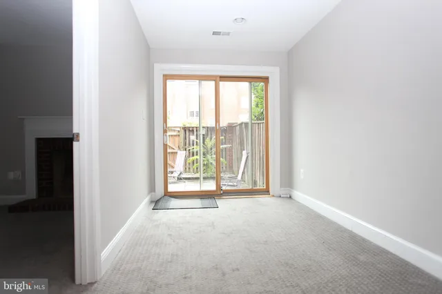 a view of an empty room with a window