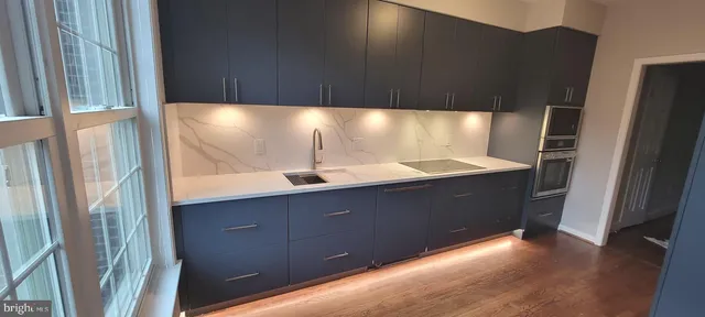 a bathroom with a double vanity sink and mirror