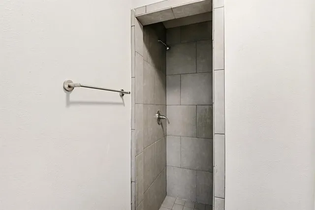 a bathroom with a glass shower door