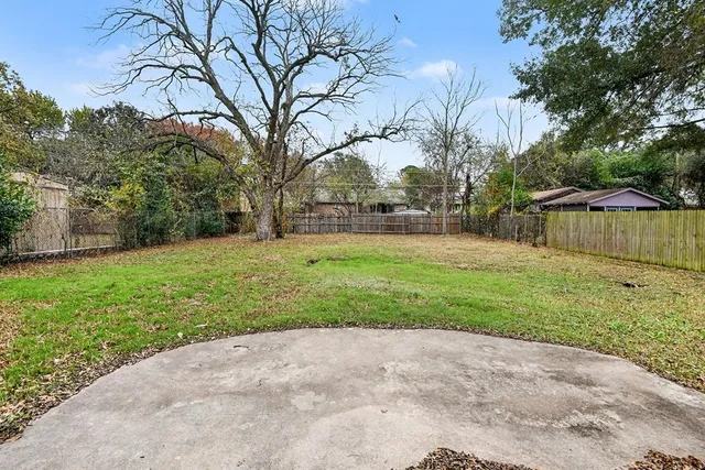 a backyard of a house with lots of green space