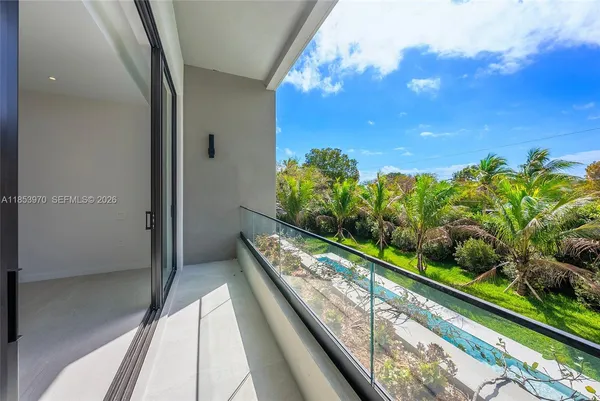 a large white tub sitting next to a bathroom sink