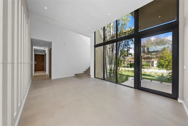 a view of an empty room with glass windows