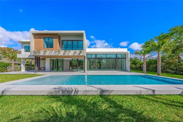 a large room with a large window and chandelier