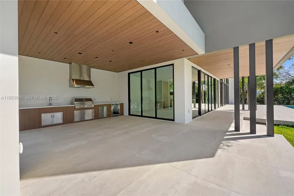 a view of a house with a yard and sitting area