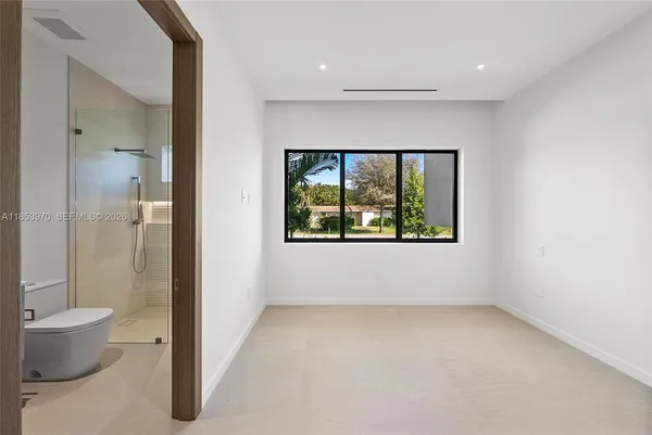 a view of an empty room with a window