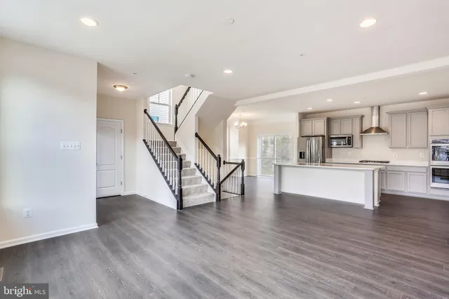 a view of kitchen with furniture and wooden floor