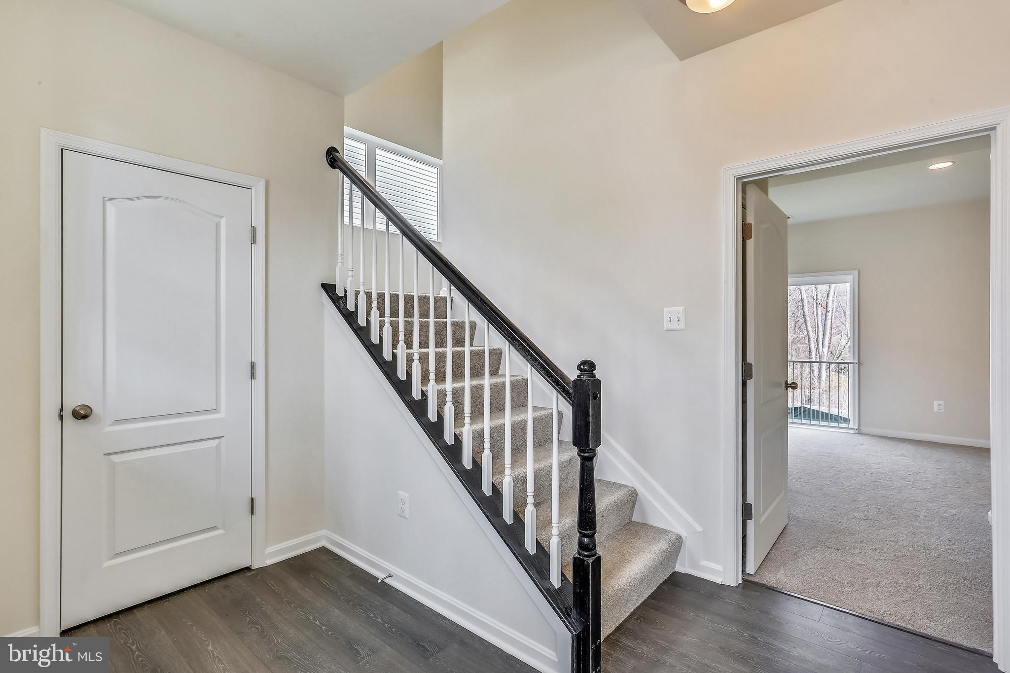 Cornfield Road Pasadena, MD 21122 - Photo 9 of 37 a view of a hallway with wooden floor and entryway