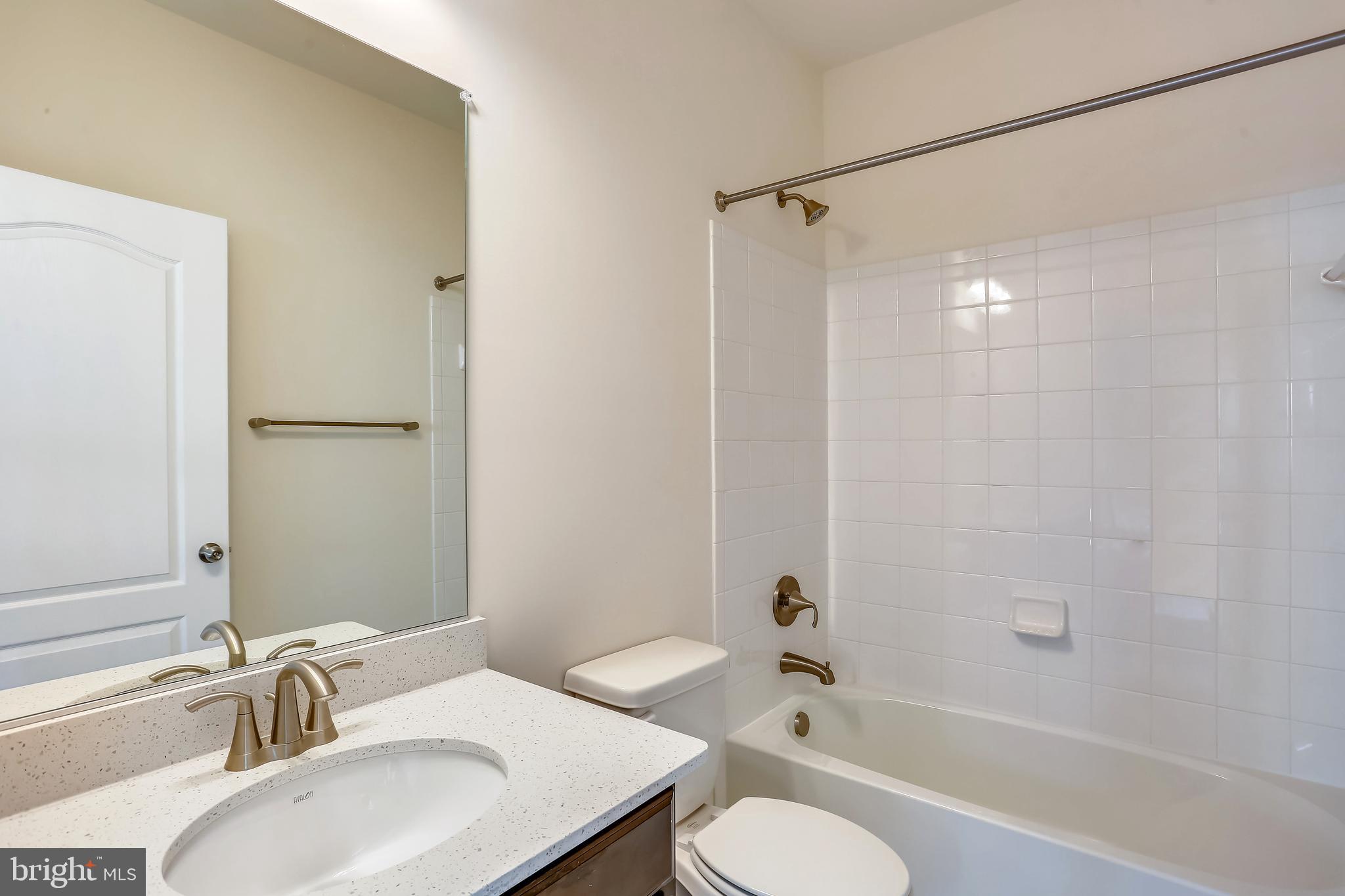 Cornfield Road Pasadena, MD 21122 - Photo 10 of 37 a bathroom with a sink toilet and shower