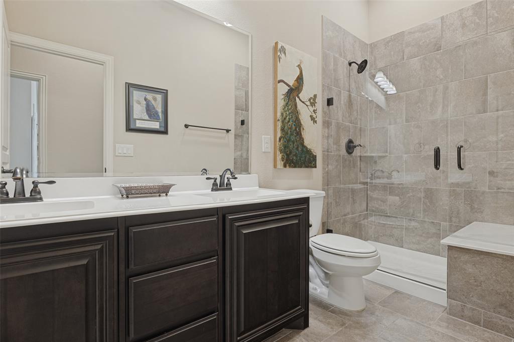 3405 Fletcher Road Heartland, TX 75114 - Photo 18 of 30 Hall bath with dual sings and walk in shower with seat.