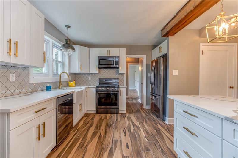 3553 Brodhead Road Monaca, PA 15061 - Photo 2 of 25 Gorgeous, soft close shaker cabinets, upgraded quartz counter tops and a large farmhouse sink.