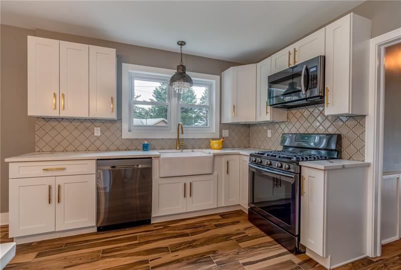 3553 Brodhead Road Monaca, PA 15061 - Photo 3 of 25 Black stainless steel appliances, cool lighting and great flooring.