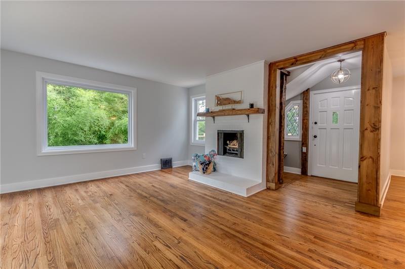3553 Brodhead Road Monaca, PA 15061 - Photo 6 of 25 Large living room, raw edge red maple mantel, 100+ year old beams from a local barn.