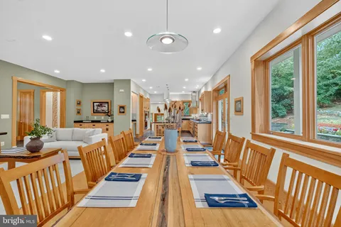 a large kitchen with stainless steel appliances granite countertop a large stove a sink and dishwasher