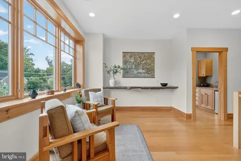 a bedroom with furniture and wooden floor