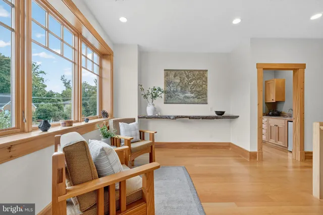 a bedroom with furniture and wooden floor