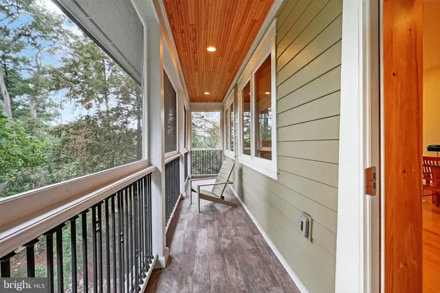 a bathroom with a granite countertop tub sink and mirror
