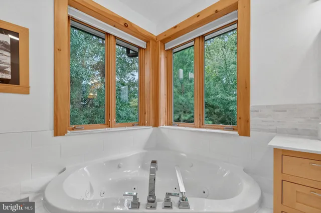 a bathroom with a glass shower door