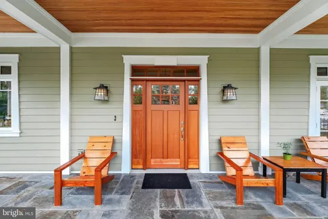 a outdoor space with a furniture and a rug