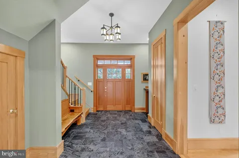 a view of a hallway with windows and stairs