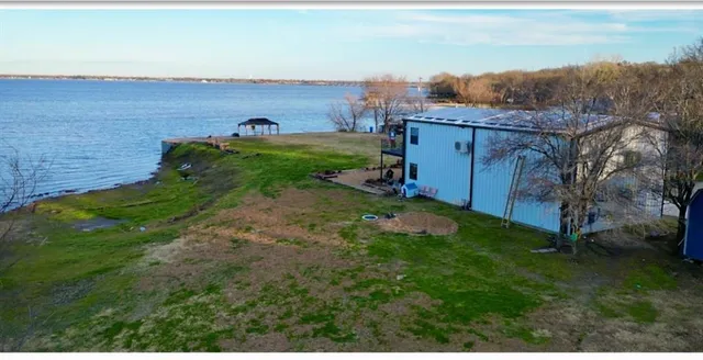 a view of a field with an ocean