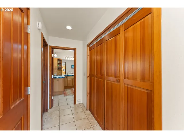 a view of a hallway with a bathroom