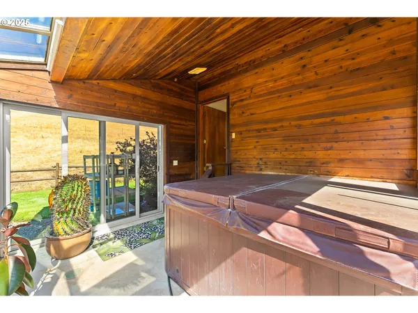 a living room with a floor to ceiling window and floor