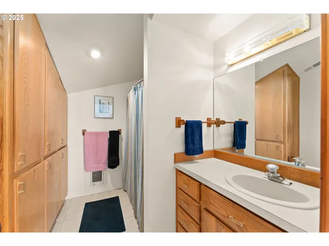 a bathroom with a sink and mirror