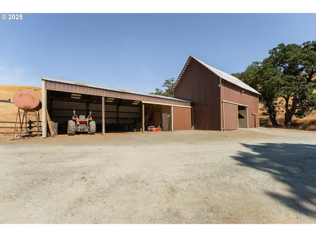 a view of a house with a yard and garage