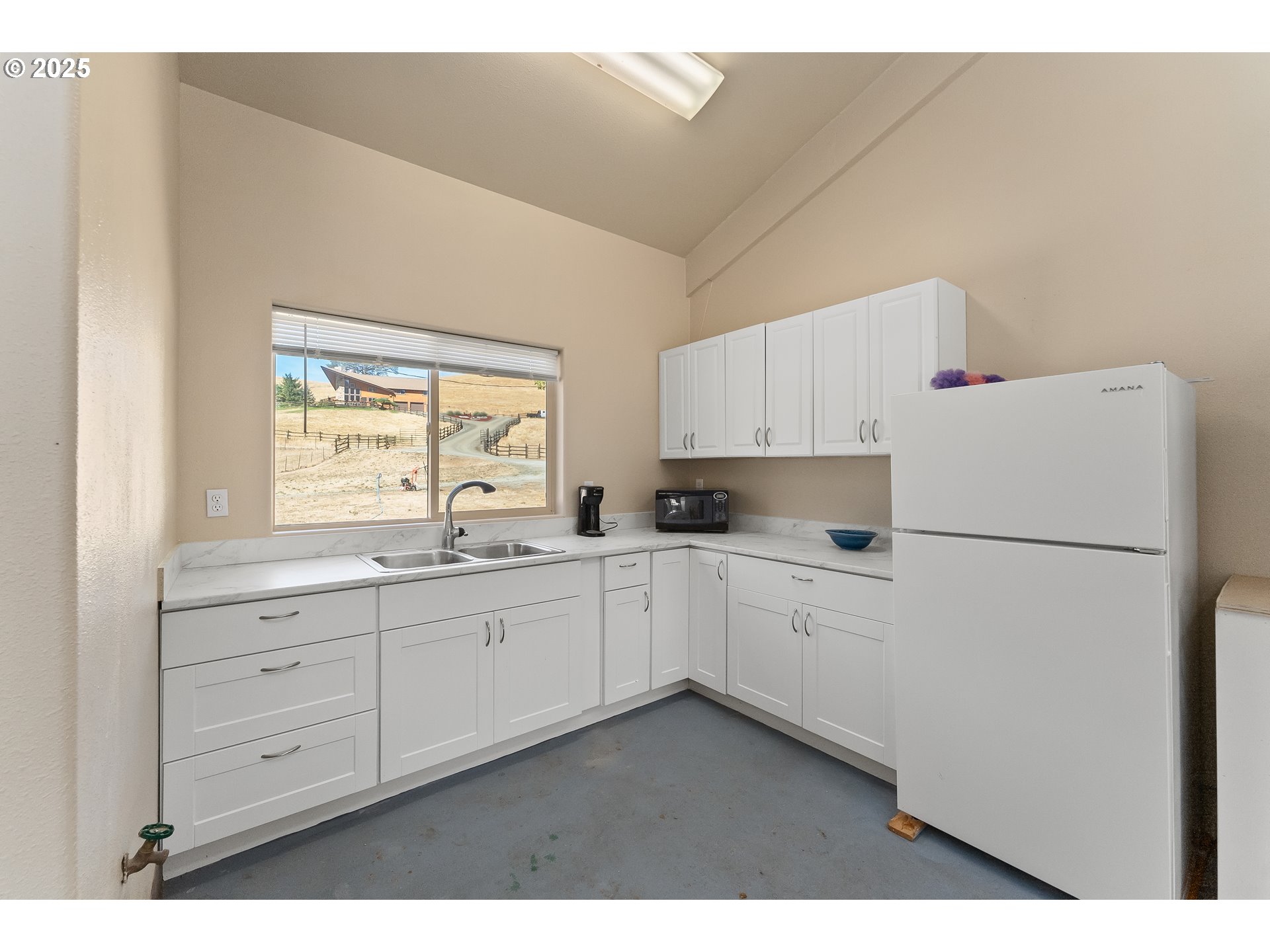 325 Beals Creek Road Canyonville, OR 97417 - Photo 44 of 47 a kitchen with cabinets appliances a sink and a window