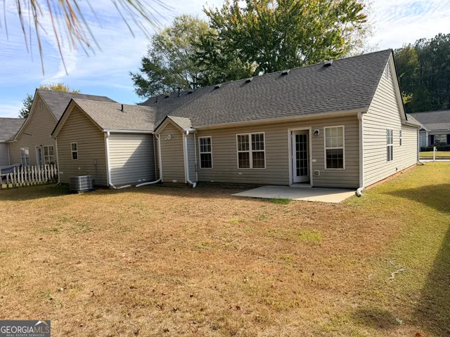 a kitchen with a sink cabinets and a window
