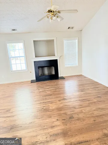 a view of a house with a yard and garage