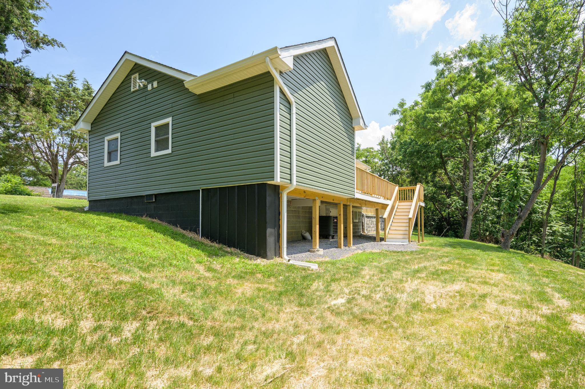 2968 Sulphur Springs Road Inwood, WV 25428 - Photo 13 of 65 Charming green home nestled in nature.