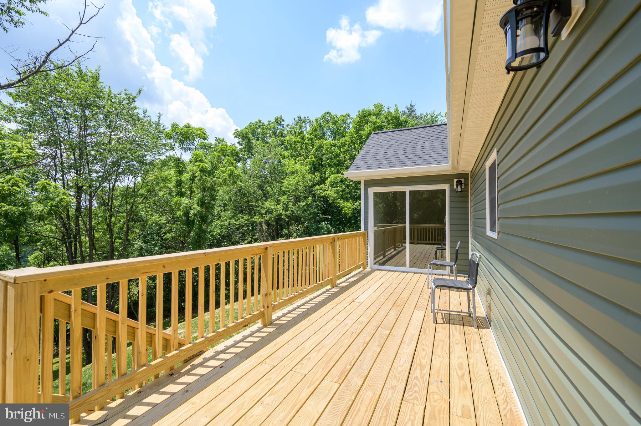 2968 Sulphur Springs Road Inwood, WV 25428 - Photo 20 of 65 Serene deck overlooking lush greenery.