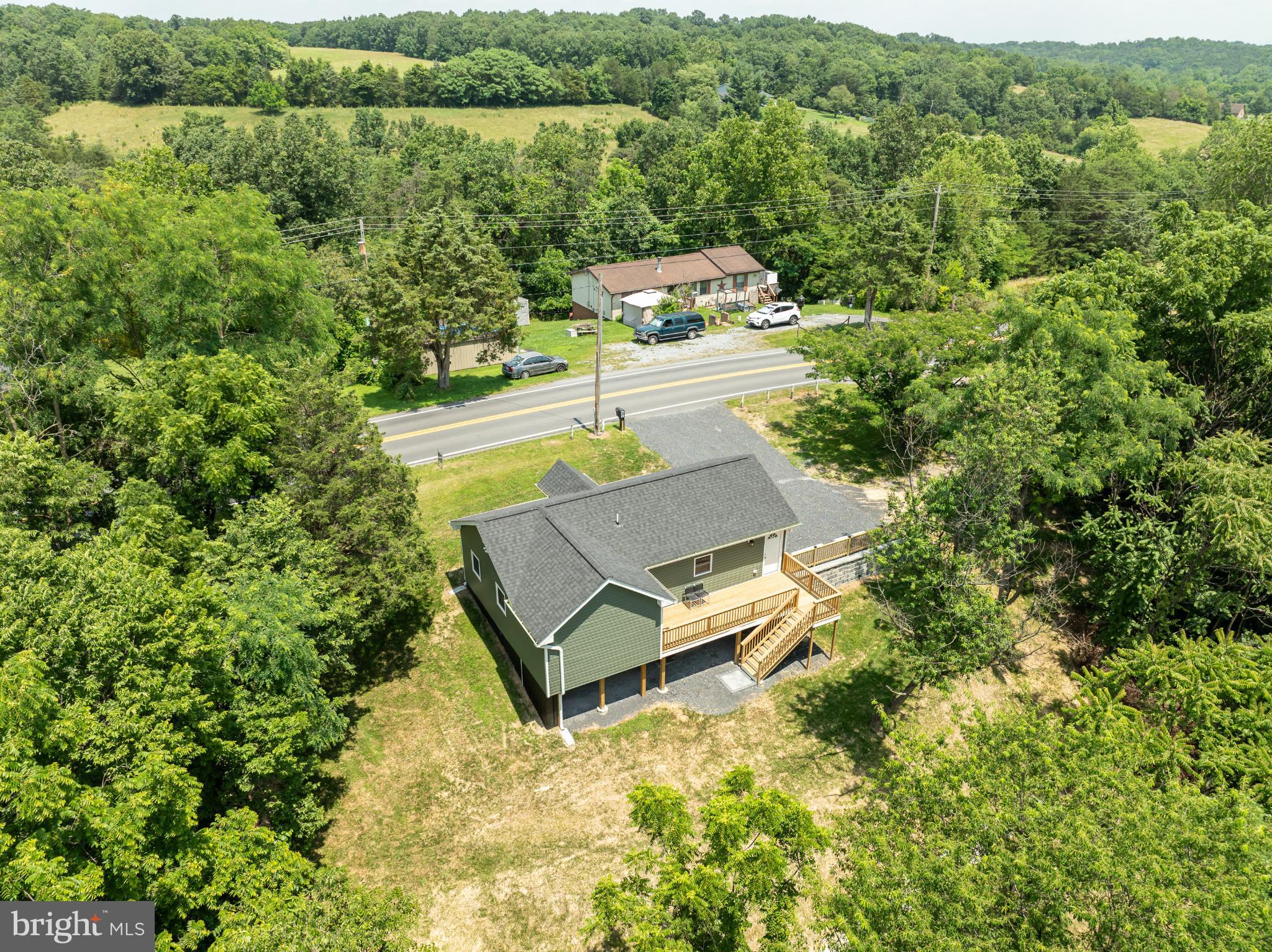 2968 Sulphur Springs Road Inwood, WV 25428 - Photo 29 of 65 Serene home nestled among lush greenery.