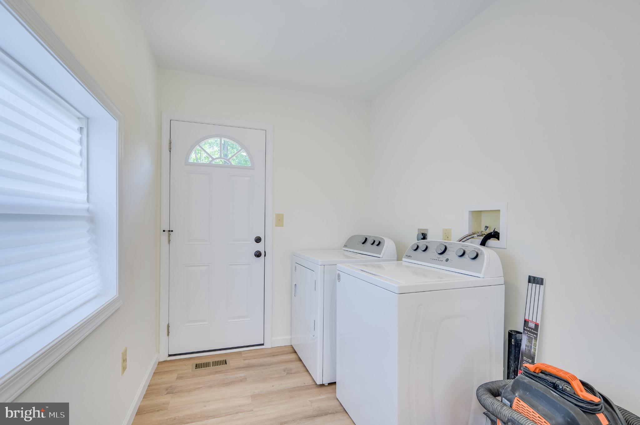 2968 Sulphur Springs Road Inwood, WV 25428 - Photo 41 of 65 Bright and airy laundry space with entryway charm.